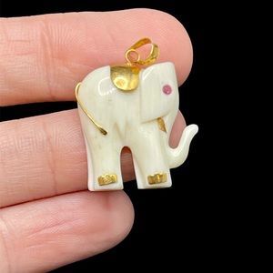 Antique 18kt gold elephant pendant with ruby eye